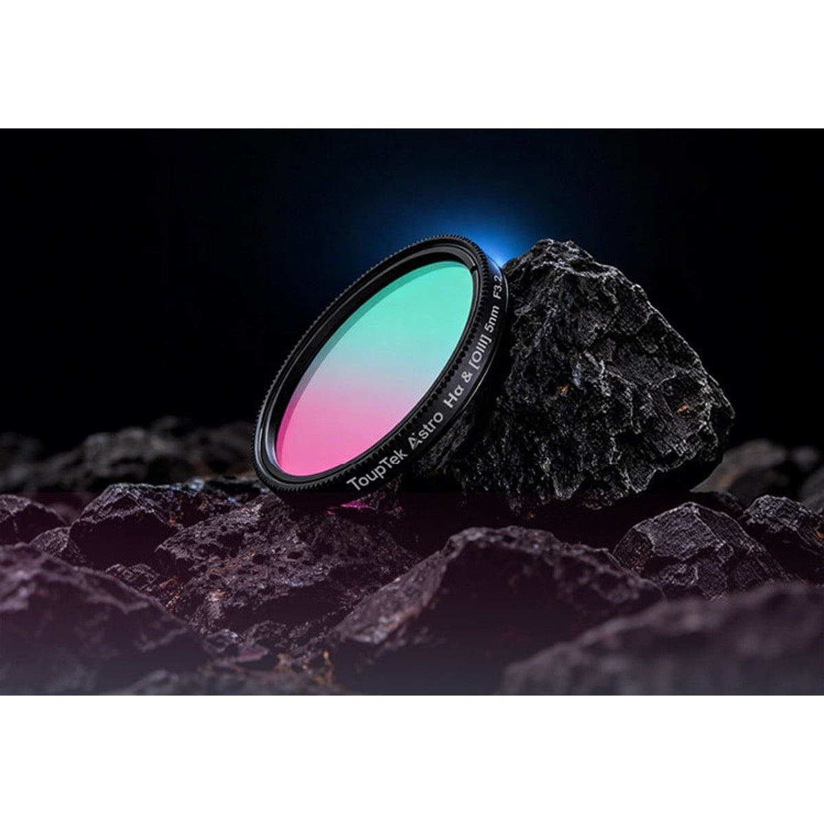Telescope filter with gradient colors on a dark rock surface