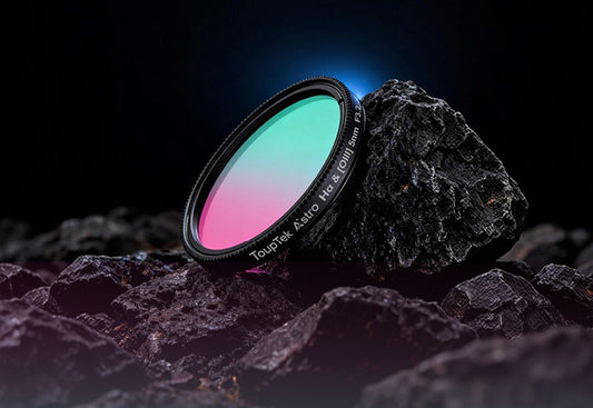 Telescope filter with gradient colors on a dark rock surface