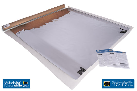 AstroSolar Clear White Giant Size roll-up solar panel backsheet, shown partially unrolled with its kraft paper core visible, accompanied by two instruction sheets on a white background.