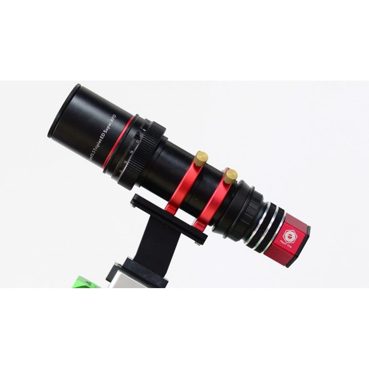 Camera lens with red and black design on a white background