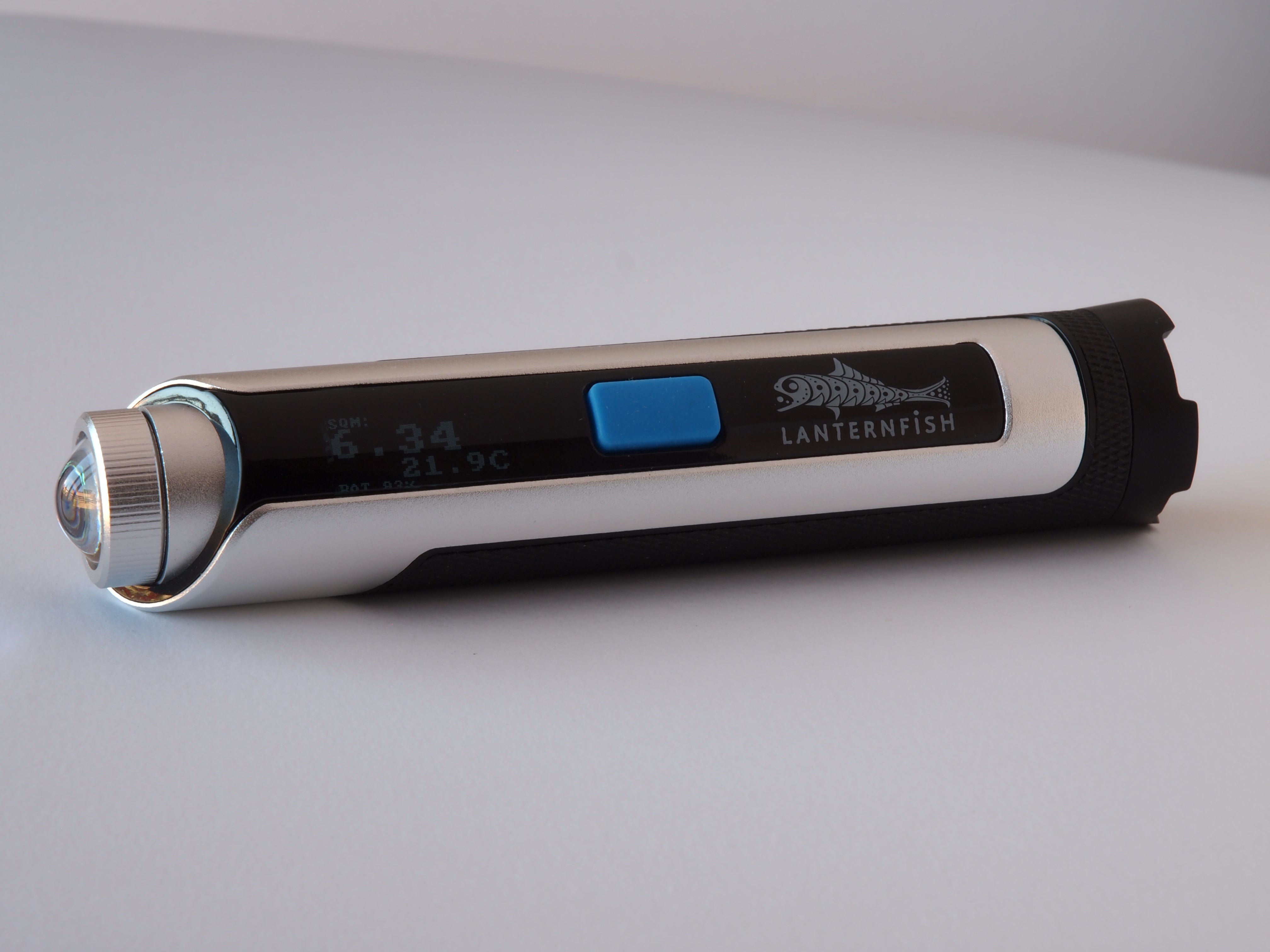 Lunatico  Lanternfish sky quality meter device with digital display on a light grey background