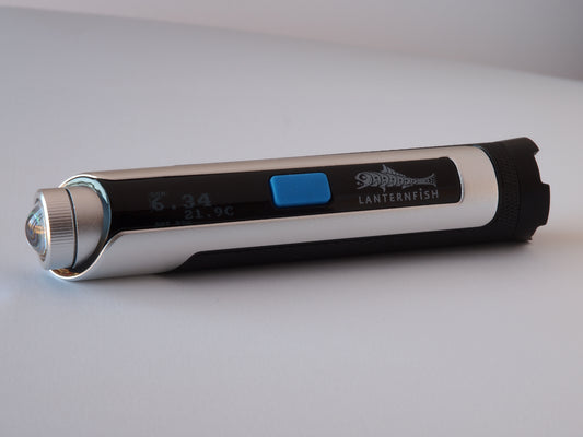 Lunatico  Lanternfish sky quality meter device with digital display on a light grey background