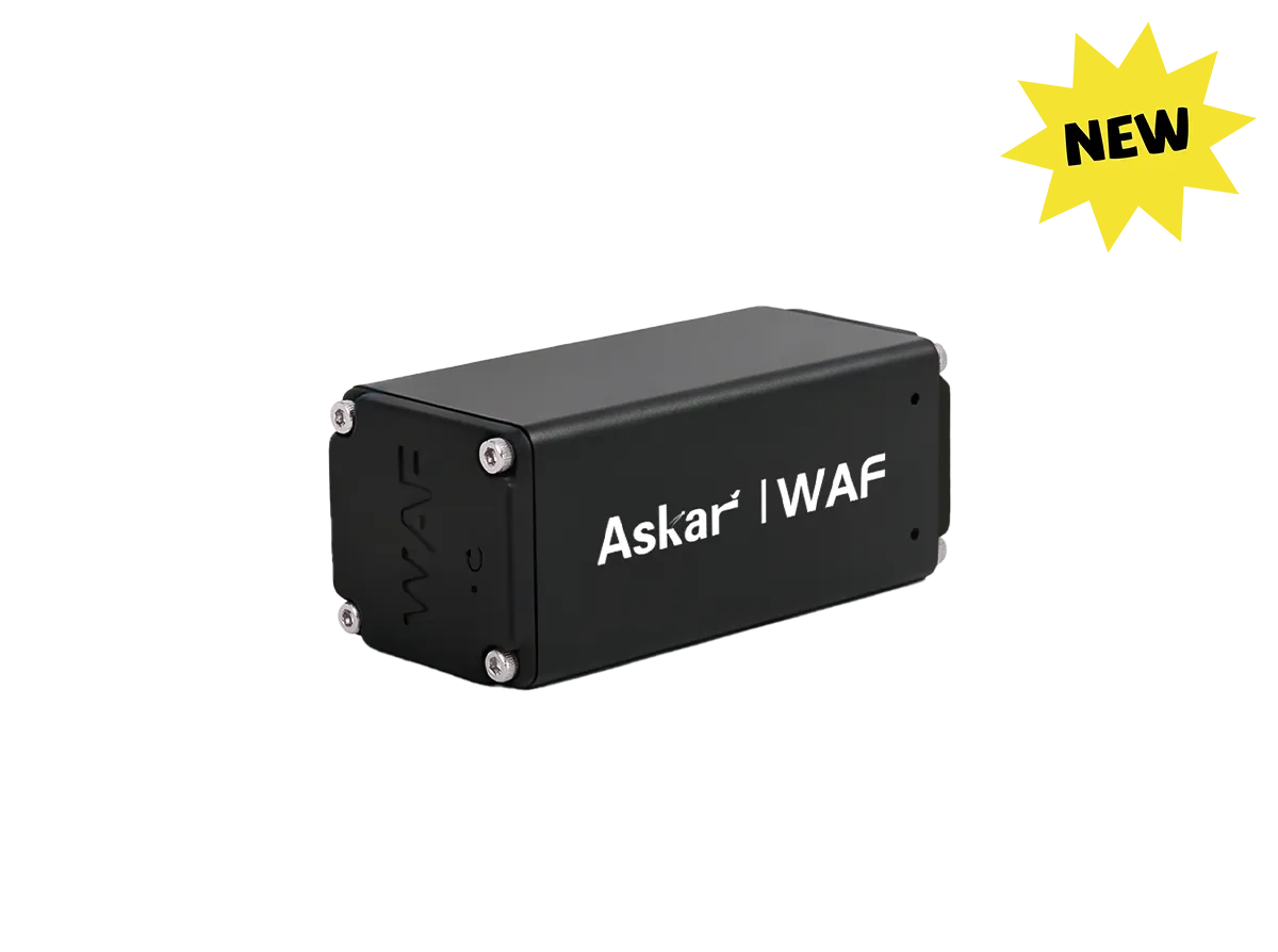 A black rectangular electronic module labeled 'Askar | WAF' with silver screws at the corners, shown on a plain white background with a yellow 'NEW' starburst in the top right corner.