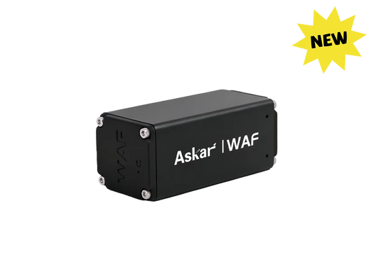 A black rectangular electronic module labeled 'Askar | WAF' with silver screws at the corners, shown on a plain white background with a yellow 'NEW' starburst in the top right corner.