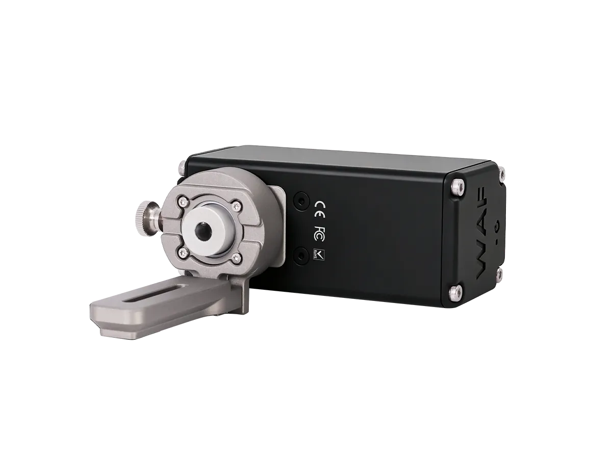 A black rectangular electronic device with a silver motor or sensor module and a gray mounting bracket, shown on a plain white background. The side of the black casing has the brand name 'WAF' printed vertically.