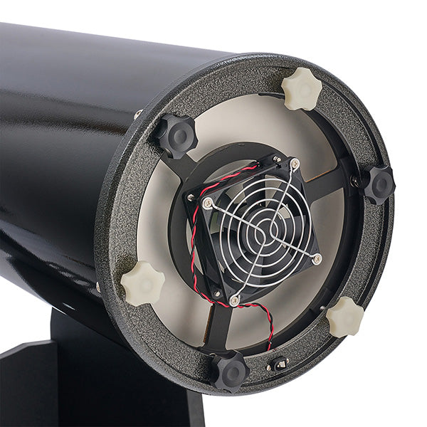 Close-up of a black cylindrical object with a fan inside on a white background