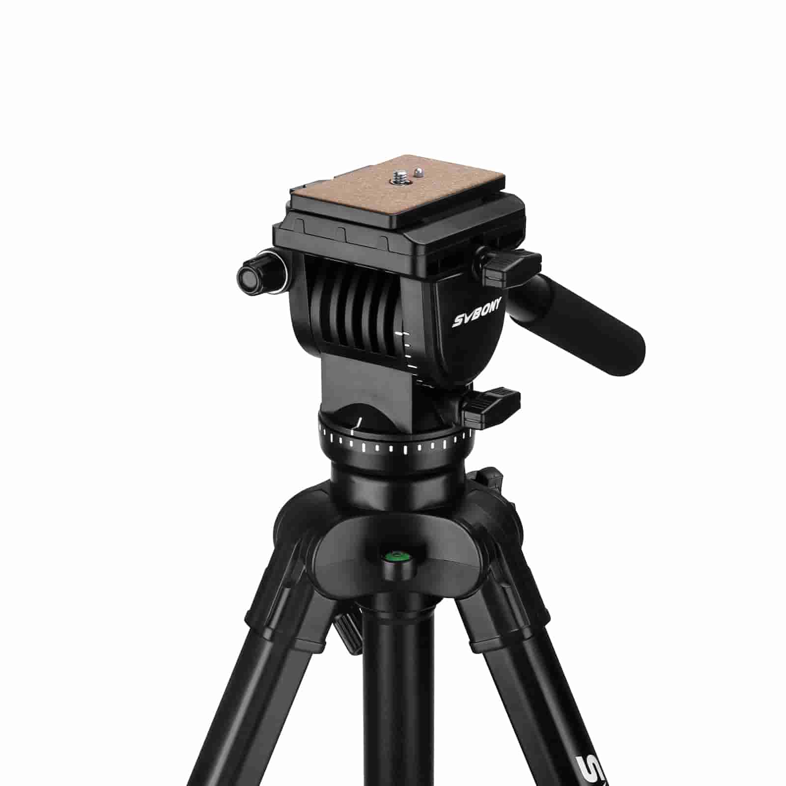 Black camera tripod with head on a white background