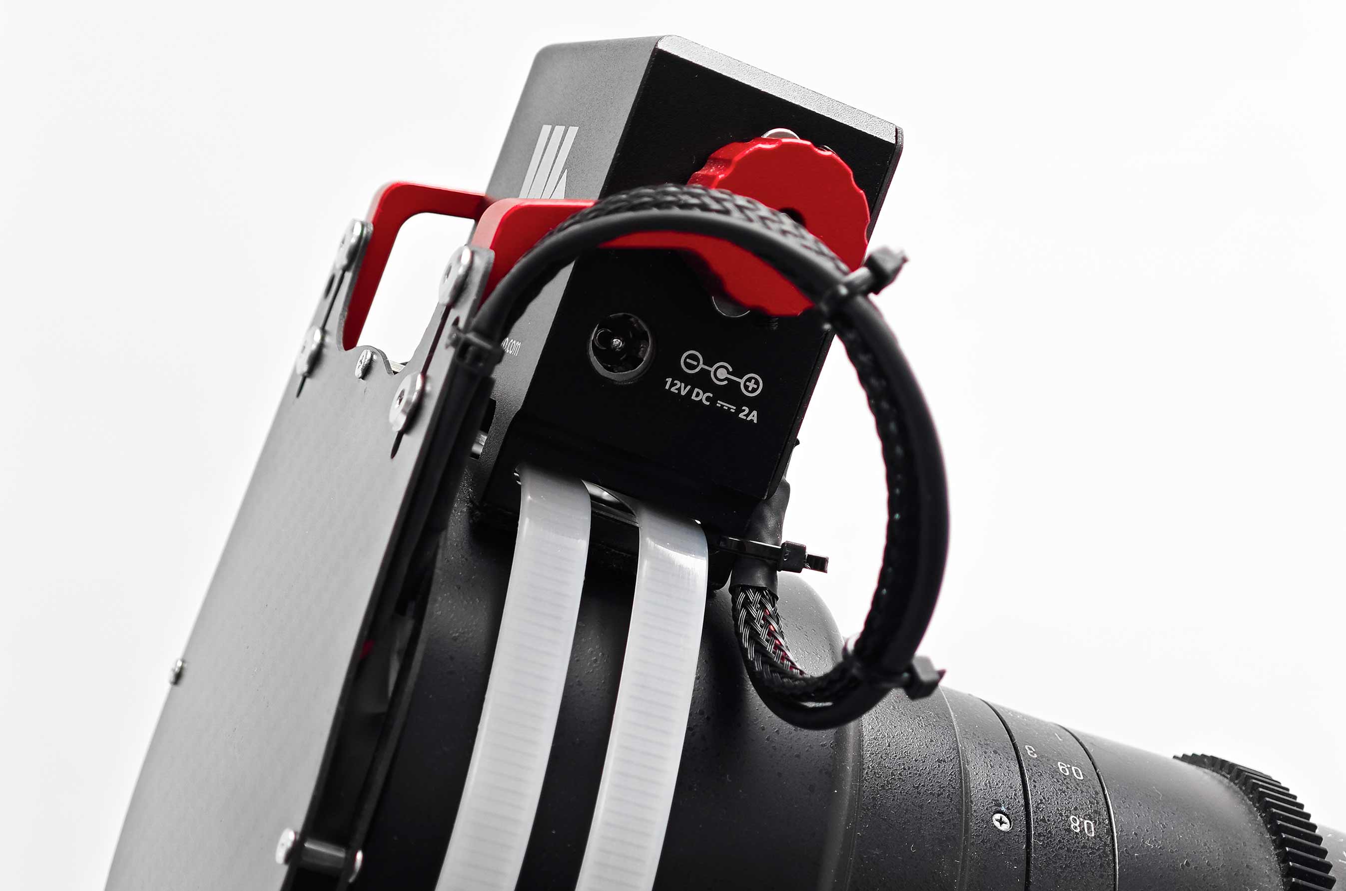 Close-up of the WandererCover V4-EC IR control module and motor assembly mounted on a telescope
